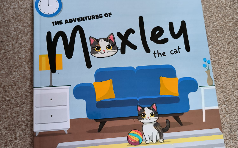 Photo of Moxley the cat book